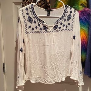 blue and cream embroidered top